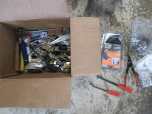 lot 28 image: Assorted Hinges, hangers, drawer slides and hand tools
