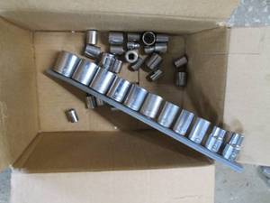 lot 29 image: Craftsman 13pc Metric & 13pc SAE 38in Shallow socket sets plus 12in socket set on rail clip