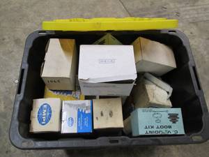 lot 46 image: Heavy duty storage tote with assorted CV joint boot kits and other automotive parts