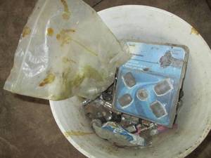 lot 49 image: 5-gallon bucket loaded with new and pre-owned lug nuts