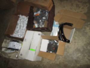lot 265 image: Box of PVC Fittings, Sioux Chief insulated hangers, Metal safety support handles and more