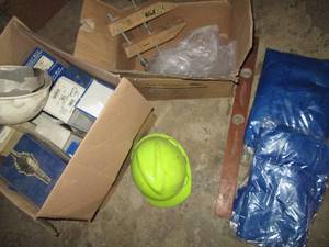 lot 267 image: Box of CV axle boot kits, hard hats, wood level and clamp plus disposable aprons