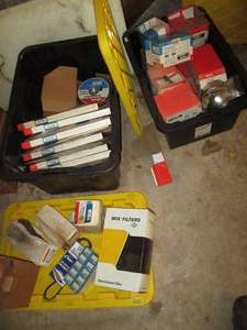 lot 284 image: 2-Heavy duty storage totes containing automotive head lamps, transmission filters, Brake pads, hose and tubing