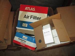 lot 298 image: Large box of Assorted Atlas Head Lamps, air filters and Oil filters