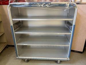 lot 71 image: MSRP $4,000 4-Shelf Metal Supply Storage Linen Laundry Cart with Snap Front Removable Transparent Plastic Curtain - In Excellent Condition&nbsp&nbspDurability Is A Lifetime