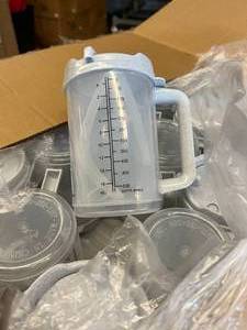 lot 114 image: MSRP $500  1 Case (50 each) NEW Care Line 006-0497 20 oz. Plastic Graduated Measuring Mugs With Straws -Features air insulation between the outer and inner parts -dishwasher and microwave safe