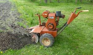 lot 1 image: Walk behind Ditch Witch C99 Trencher - works good