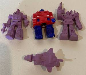 lot 44 image: (4) Mini Transformer Rubber Vintage Toy Figurines