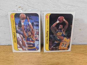 lot 139 image: (2) 1986 Fleer Basketball Stickers - Alex English & Adrian Dantley