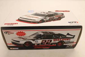 lot 40 image: Brad Keselowski 1st Edition Dodge Challenger Champion Series Limited Edition Die-cast Stock Car Replica with Box