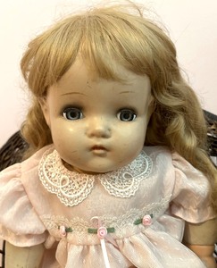 lot 48 image: Adorable Vintage Madame Alexander Doll and Woven Chair