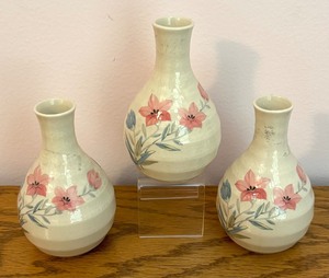 lot 93 image: Pretty Pink Floral Saki Set