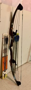 lot 63 image: Vintage Bear Archery Bow and Arrows