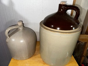 lot 322 image: Two Vintage Stoneware Jugs - Large Antique  Crock with Brown Top and Cork and Cream Jug
