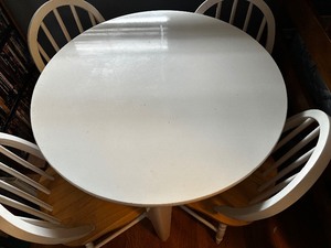 lot 32 image: Childrens Table With Four Chairs Measuring 29 Inches Diameter By 23 Inches Tall