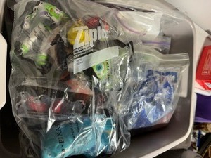 lot 295 image: Bin of Collectible Disney Toys