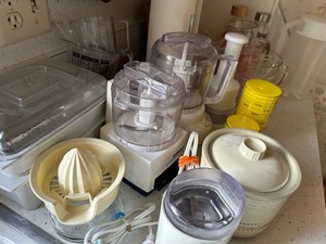 lot 89 image: Pyrex Cutting Boards Paper Towel Holder Measure Cups Juicer Coffee Grinder As Seen in Photo