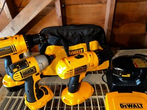 lot 414 image: Dewalt Tool Bag Filled With Charger, Bits, Half Inch Cordless Drill Driver Quarter Inch Cordless Impact Driver And Half Inch Cordless Drill Driver And 6 12 Inch Cordless Circular Saw In Craftsman Bag