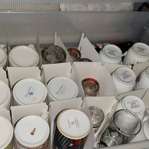 lot 339 image: Bin Of Assorted Holiday Coffee Mugs.