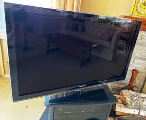 lot 11 image: Samsung TV 51 With Black TV Stand And DVDVCR Player 26W x 15H