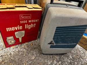 lot 291 image: Vintage 8 Mm Projector With Side Mount Light, And Projector Screen