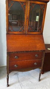 lot 2 image: Vintage Wood And Glass Secretary With Glass Doors Over Shelf And Two Drawers Measuring 28 X 16 X 70 Tall. Made By Illinois Cabinets