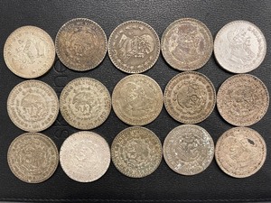 lot 121 image: Silver One Peso Coins