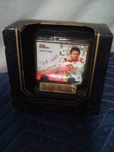 lot 106 image: 2 Nascar license plates and Ricky Rudd car & card in pkg