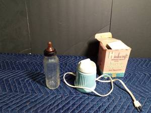 lot 53 image: Vintage glass baby bottle and bottle warmervaporizer