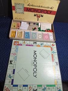 lot 68 image: 1954 Monopoly game with all the pieces except 1 dice