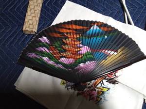 lot 90 image: 1 oriental embroidered and 1 navy scarf, 2 oriental fans in original boxes, Canada hat and duel flags
