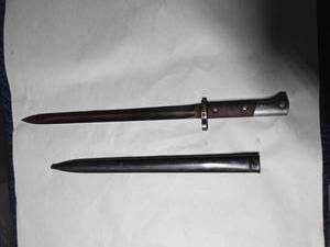 lot 315 image: Bayonet with woodmetal handle and a metal sheath