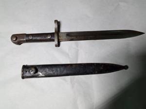 lot 317 image: Bayonet with woodmetal handle and metal sheath
