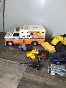 lot 402 image: Lot of Die Cast Toy Trucks, Tractors,, Motorcycles, Trains, Jets and More
