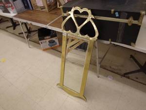 lot 24 image: Gold colored framed mirror
