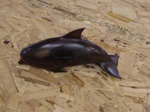 lot 29 image: Hand-Carved Wooden Dolphin Figurine