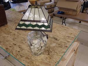 lot 55 image: Glass Base Lamp filled with Seashells