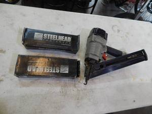 lot 14 image: Porter-Cable finish nailer with two boxes of Two and a Half Inch Nails