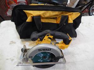 lot 28 image: DeWalt 6 and 12 in 20 volt circular saw with bag
