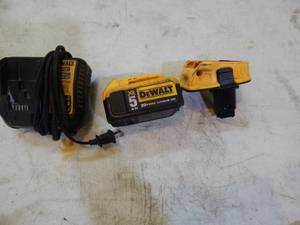 lot 31 image: DeWalt 20 volt battery with charger and 20V to 18V adapter
