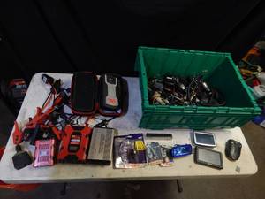 lot 68 image: Jump pack, power inverters, GPS, lights, cords and more