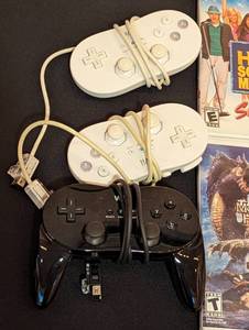 lot 25 image: Nintendo Wii Games and Controllers