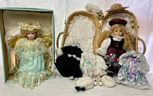 lot 26 image: Goebel Betty Jane Carter Angeligue Treetop Angel and Delton Fine Collectables Doll with 3 outfits in basket