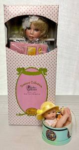 lot 25 image: Danbury Mint Finders Keepers from the Bonnet Babies Doll Collection and Paradise Galleries Angel of Peace Doll