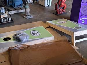 lot 86 image: Mr. & Mrs. T logo Cornhole Game