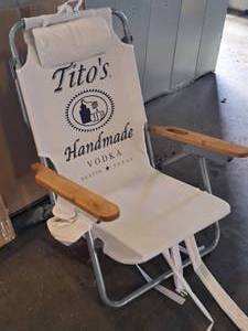 lot 87 image: Titos Vodka logo Folding Beach Chair (New)
