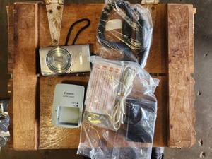 lot 196 image: Canon PowerShot Elph 350 HS Digital Camera with Accessories - (1) Batteries, (2) Chargers, (1) Car Charger
