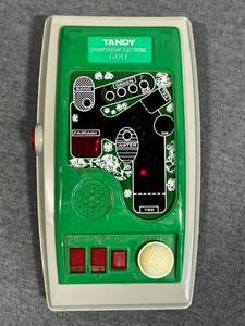 lot 28 image: Amazing Vintage Handheld Electronic Games Lot - Tandy Championship Electronic GolfTalking Brick Game Super E-118T2005 Frogger by Excalibur Electronics1995 Barbie for Girls by Micro Games of America2007 Hasbro Transformers Optimus Prime
