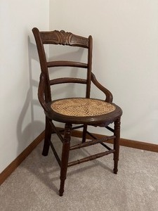 lot 2 image: Antique Brown WoodWicker Chair