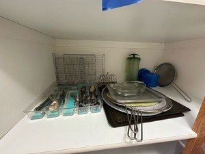 lot 235 image: Shelf of Misc Kitchen Utinsels Grease Guards Cooling racks and More as seen in photo